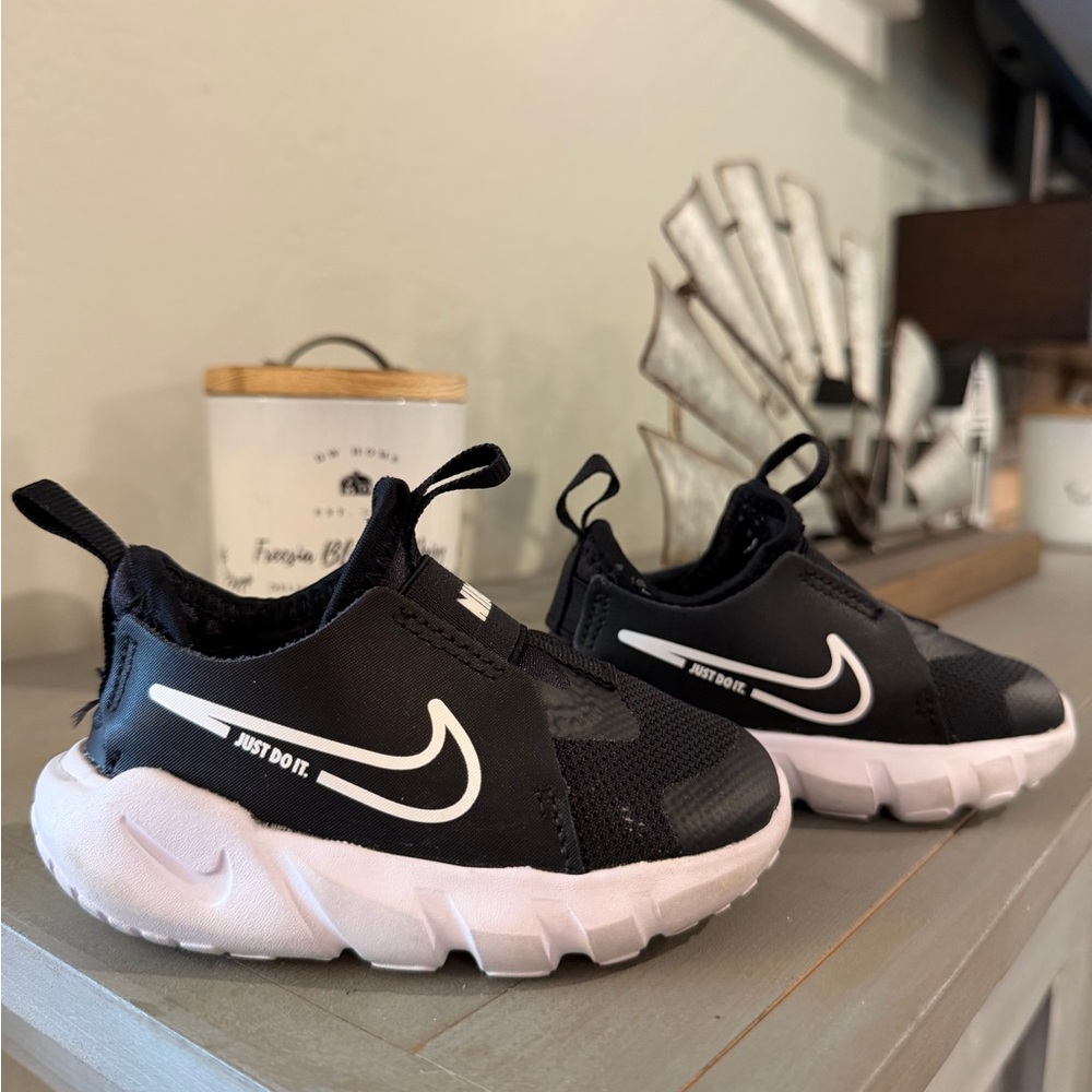 Nike Kids Black Slip-On Sneakers with White Sole and Swoosh